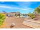 Expansive backyard with basketball court, desert landscaping, and a refreshing pool at 6311 Baker Creek St, Las Vegas, NV 89149