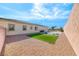 Large backyard with gravel, artificial turf, basketball court, and privacy wall at 6311 Baker Creek St, Las Vegas, NV 89149