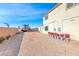 Spacious backyard with desert landscaping, potential RV parking and home exterior at 6311 Baker Creek St, Las Vegas, NV 89149