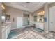 Primary bathroom featuring double sinks, vanity, walk-in shower, and neutral color palette at 6311 Baker Creek St, Las Vegas, NV 89149