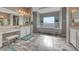 Primary bathroom with dual sinks, vanity, soaking tub, and neutral color palette at 6311 Baker Creek St, Las Vegas, NV 89149