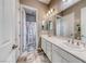 Well-lit bathroom with double sinks and shower/tub combination at 6311 Baker Creek St, Las Vegas, NV 89149