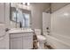 Clean, modern bathroom with a combination tub and shower at 6311 Baker Creek St, Las Vegas, NV 89149