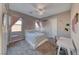 Comfortable bedroom with a ceiling fan, neutral walls and natural light at 6311 Baker Creek St, Las Vegas, NV 89149