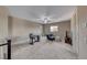 Large bonus room featuring neutral walls, ceiling fan, carpet flooring, and ample natural light at 6311 Baker Creek St, Las Vegas, NV 89149