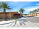 Entrance to Emerald Crest by Lennar shows lush, mature landscaping and block wall construction at 6311 Baker Creek St, Las Vegas, NV 89149