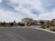 Expansive home with a brick driveway and a neutral color scheme, set against a mountainous backdrop at 6311 Baker Creek St, Las Vegas, NV 89149