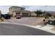 Charming two-story home with desert landscaping and a spacious driveway, perfect for multiple vehicles at 6311 Baker Creek St, Las Vegas, NV 89149