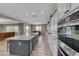 Bright kitchen with white cabinets, a large island, and stainless steel appliances at 6311 Baker Creek St, Las Vegas, NV 89149