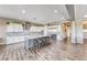 Spacious kitchen boasts a large center island with seating, stainless steel appliances, and ample counter space at 6311 Baker Creek St, Las Vegas, NV 89149