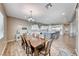 Open dining and kitchen area featuring an island with seating and stainless steel appliances at 6311 Baker Creek St, Las Vegas, NV 89149