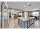 Gourmet kitchen with stainless steel appliances, a large island, and an open floor plan at 6311 Baker Creek St, Las Vegas, NV 89149