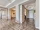 Spacious open living area with modern gray walls and hardwood floors at 6311 Baker Creek St, Las Vegas, NV 89149