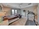 Spacious main bedroom featuring a tray ceiling, sitting area, and personal fitness equipment at 6311 Baker Creek St, Las Vegas, NV 89149