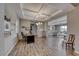 A bright, open home office with tray ceilings and wood floors at 6311 Baker Creek St, Las Vegas, NV 89149