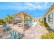Relaxing backyard featuring a pergola with dining furniture and a well maintained pool at 6311 Baker Creek St, Las Vegas, NV 89149