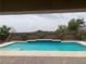 Beautiful backyard pool with sleek tile details and a calming desert mountain view, creating an oasis at 6311 Baker Creek St, Las Vegas, NV 89149