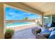 Inviting covered patio overlooking a refreshing pool, perfect for outdoor relaxation and entertaining at 6311 Baker Creek St, Las Vegas, NV 89149