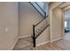 Beautiful staircase with wood and carpet flooring and a contrasting railing at 6311 Baker Creek St, Las Vegas, NV 89149