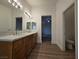 Bathroom features a double sink vanity with a marble countertop, and a separate toilet area at 6638 Babys Tear Pl, Las Vegas, NV 89148