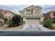 Inviting two-story home with a two-car garage and neutral stucco exterior, located in a well-maintained neighborhood at 6638 Babys Tear Pl, Las Vegas, NV 89148
