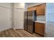 Updated kitchen featuring stainless steel appliances and wood-look floors at 6638 Babys Tear Pl, Las Vegas, NV 89148