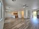Open concept living space with hardwood floors, recessed lighting, and staircase at 6638 Babys Tear Pl, Las Vegas, NV 89148