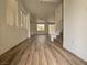 Spacious living room with stylish flooring, plenty of natural light, and an open layout perfect for entertaining at 6638 Babys Tear Pl, Las Vegas, NV 89148