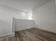 Loft with wood floors and white walls at 6638 Babys Tear Pl, Las Vegas, NV 89148
