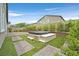 Backyard oasis with a modern hot tub, artificial grass, and beautiful landscaping at 7224 Anora St, North Las Vegas, NV 89084