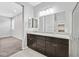 Bathroom showcasing double sinks, granite countertops, and a glass-enclosed shower at 7224 Anora St, North Las Vegas, NV 89084