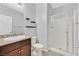 Neutral bathroom featuring a shower and granite countertops at 7224 Anora St, North Las Vegas, NV 89084