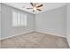 This cozy bedroom features a ceiling fan, and a window with shutters, creating a relaxing space at 7224 Anora St, North Las Vegas, NV 89084