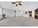 Bright and spacious living area with tile flooring and views into kitchen and other rooms at 7224 Anora St, North Las Vegas, NV 89084