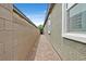 Paver side yard between a wall and the home's exterior at 7224 Anora St, North Las Vegas, NV 89084