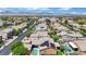 Expansive aerial view of the property, showcasing a private pool, solar panels, and mature landscaping at 7300 Fresh Harvest Ave, Las Vegas, NV 89131