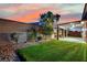 Low-maintenance backyard with artificial grass, a covered patio, and privacy walls at 7300 Fresh Harvest Ave, Las Vegas, NV 89131