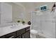 Bathroom featuring a vanity with white countertops, a glass-enclosed shower, and neutral decor at 7300 Fresh Harvest Ave, Las Vegas, NV 89131