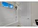 Bathroom featuring a shower-tub combo, white subway tiles, and a decorative plant at 7300 Fresh Harvest Ave, Las Vegas, NV 89131