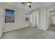 Empty bedroom showcasing neutral walls, carpet floors, and an archway entrance at 7300 Fresh Harvest Ave, Las Vegas, NV 89131