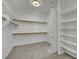 Spacious walk-in closet with built-in shelving and ample storage space at 7300 Fresh Harvest Ave, Las Vegas, NV 89131