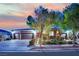 Charming single-story home with well-manicured landscaping, a three-car garage, and a cozy front entrance at 7300 Fresh Harvest Ave, Las Vegas, NV 89131