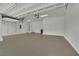Large, clean garage space featuring an open layout, painted floors, and ample storage capacity at 7300 Fresh Harvest Ave, Las Vegas, NV 89131