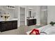 Luxurious main bathroom featuring dual vanities, and a soaking tub at 7300 Fresh Harvest Ave, Las Vegas, NV 89131
