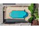 Aerial view of a backyard pool, with green lawn and an outdoor living space at 7300 Fresh Harvest Ave, Las Vegas, NV 89131