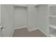 Walk-in closet featuring ceramic tile floor, shelves, and closet rods at 7300 Fresh Harvest Ave, Las Vegas, NV 89131
