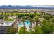 Scenic aerial view of the community's pool, spa, and lush landscaping at 7332 Redhead Dr, North Las Vegas, NV 89084