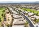 An aerial view of a neighborhood with rows of houses along the street at 7332 Redhead Dr, North Las Vegas, NV 89084