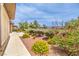 A beautifully landscaped backyard featuring well-maintained shrubs and gravel at 7332 Redhead Dr, North Las Vegas, NV 89084