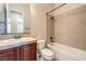 Bathroom featuring vanity sink, toilet and shower-tub combination at 7332 Redhead Dr, North Las Vegas, NV 89084